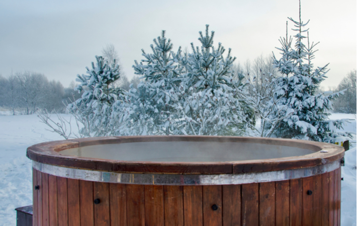 wooden spa hot tub outdoors in winter