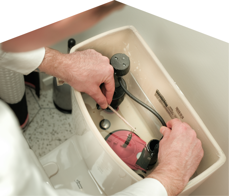 Furnasman plumbing specialist adjusts internal components of a toilet tank, with tile flooring visible in the background. Furnasman plumbing specialist adjusts internal components of a toilet tank, with tile flooring visible in the background.